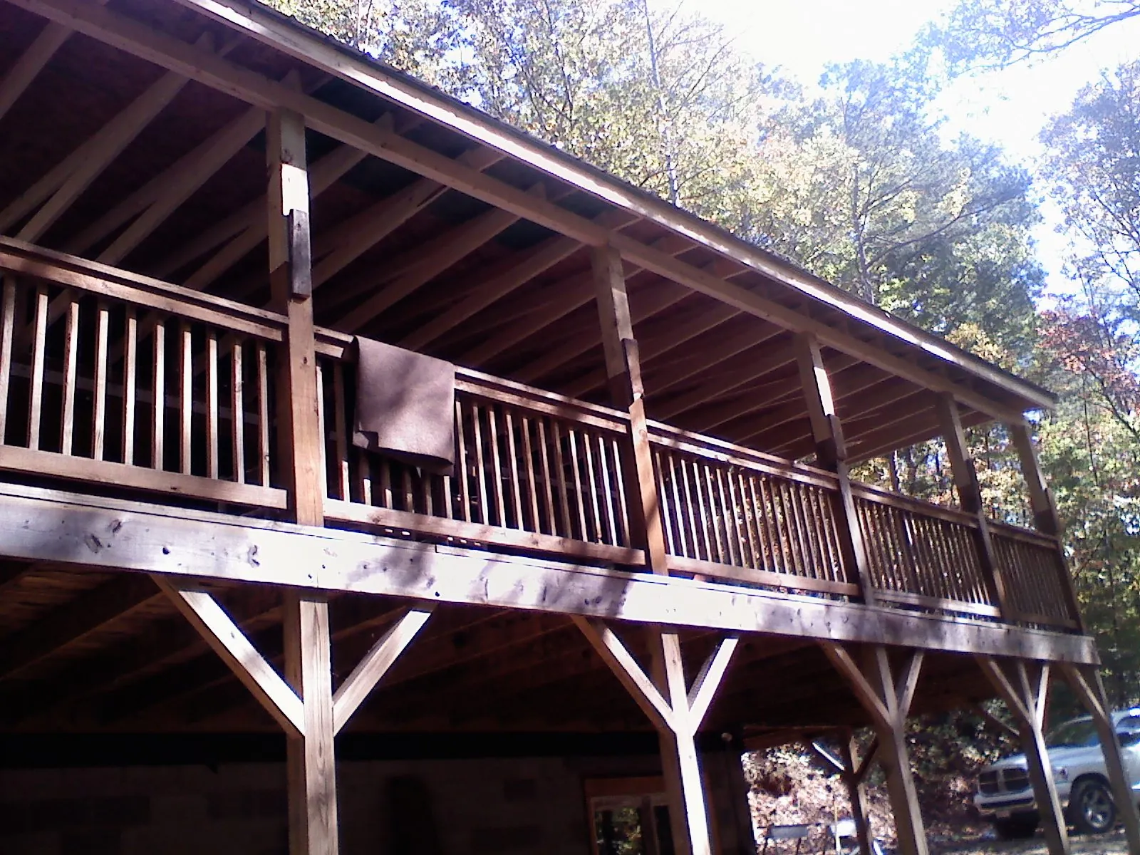 Timber framing under a new elevated porch and deck — Roof Leak Repair in Highland Park by Roofing Brothers